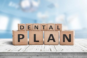 Blocks spell out “dental plan”