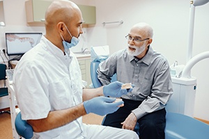 Your dentures can help protect your remaining natural teeth