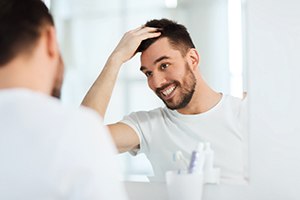 Patient in Toronto smiling with dental implants