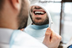 Patient in Toronto smiling with dental implants