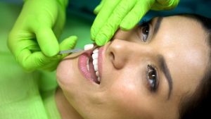 a woman getting porcelain veneers