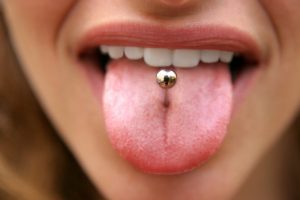 woman with tongue piercing
