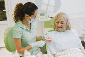 Woman in dental chair for dentures