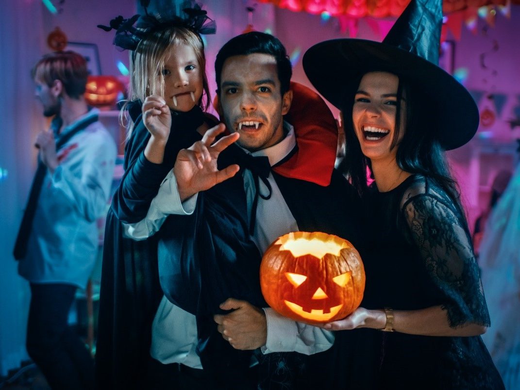 family dressed in Halloween costumes